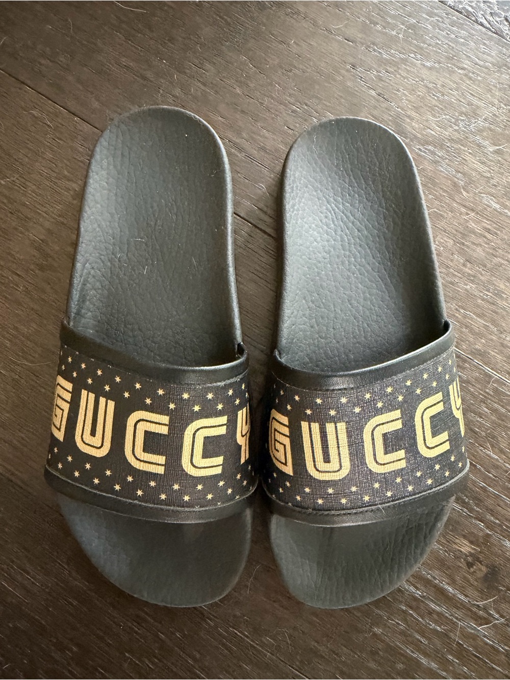 Gucci Black Slides with Gold Logo Stars